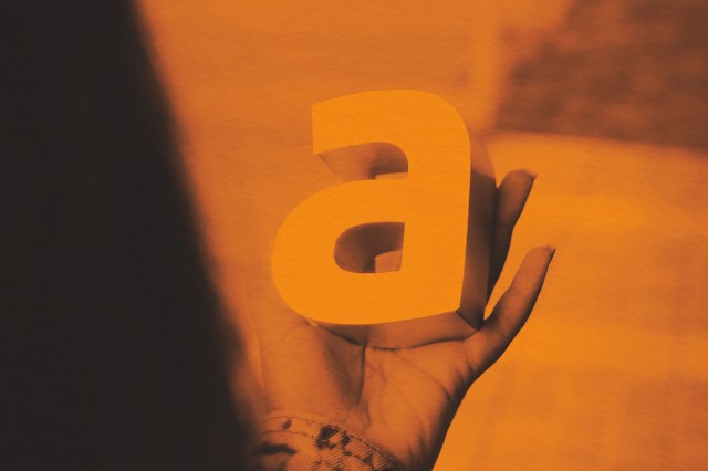 Person holding the letter A