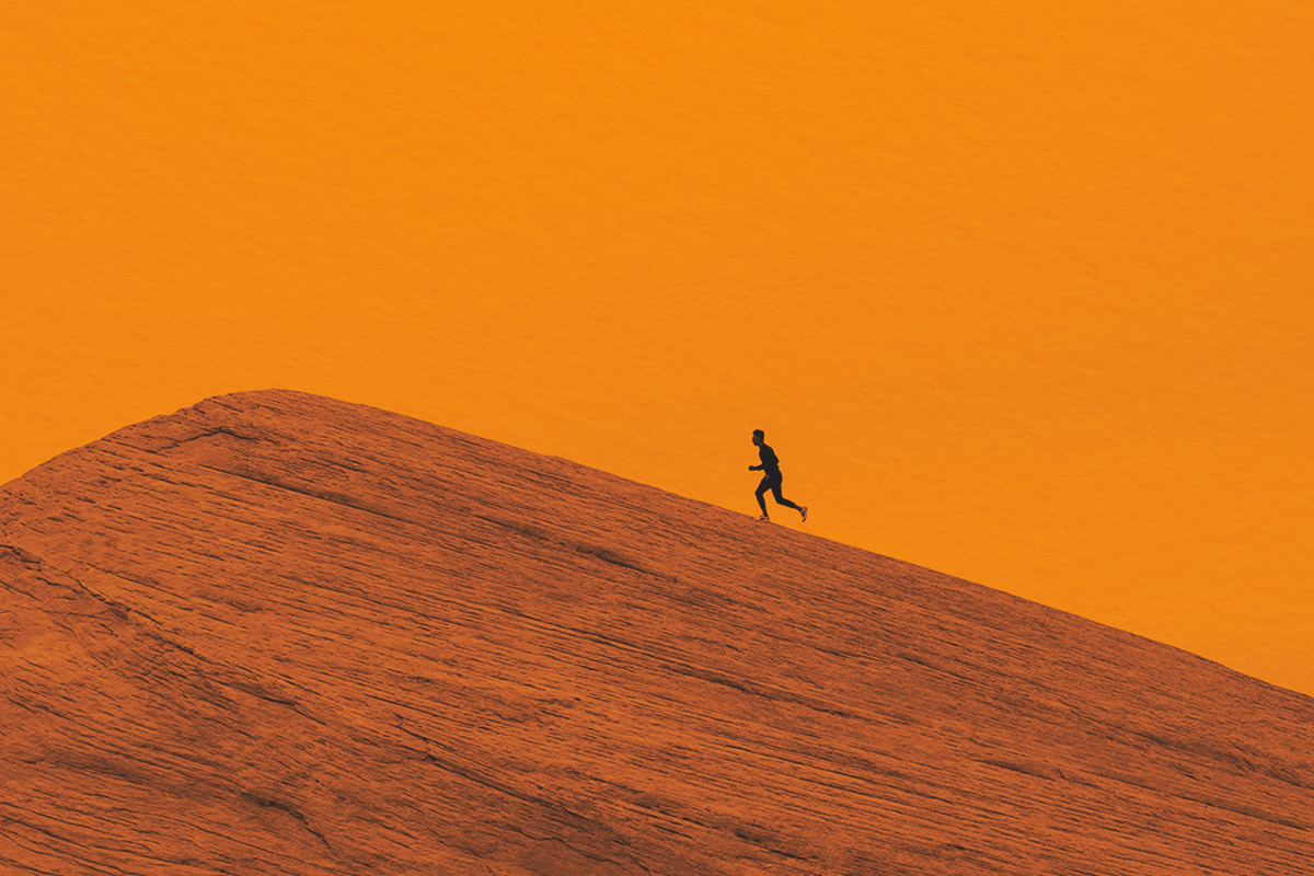 Person running on top a hill