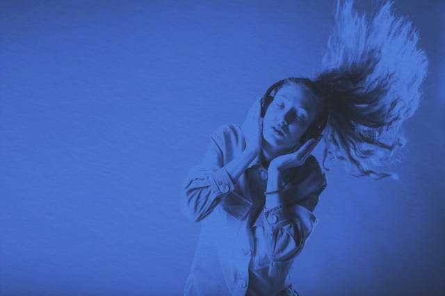 girl listening to the music and fliping her hair