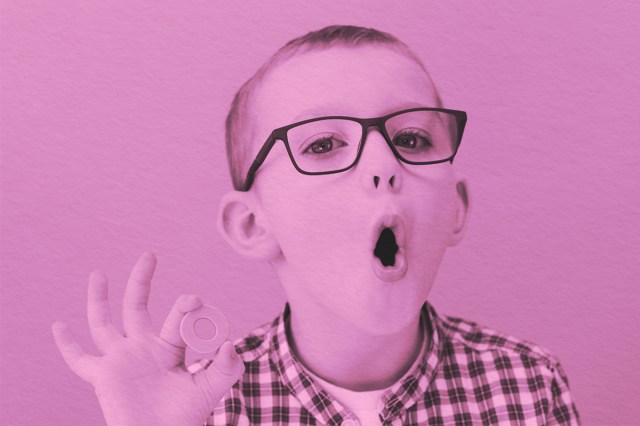 Young boy learning to pronounce letters