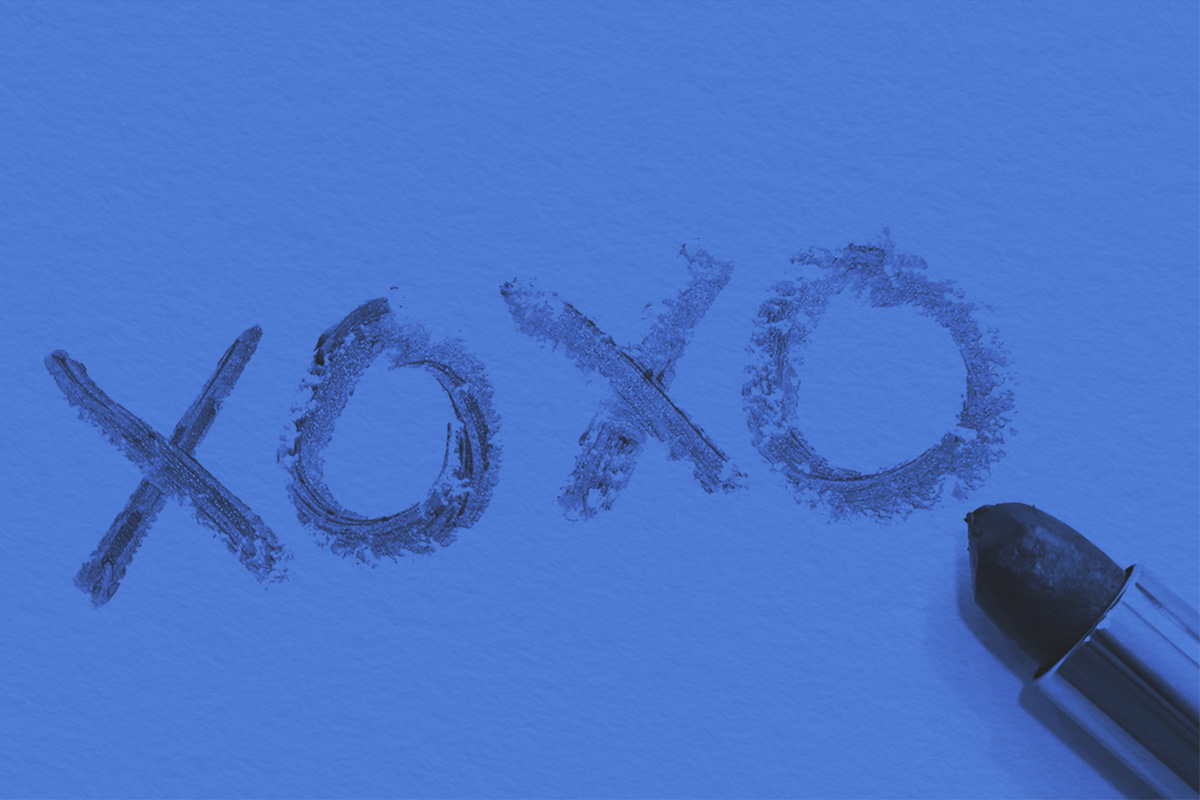 XOXO written on a piece of paper with lipstick