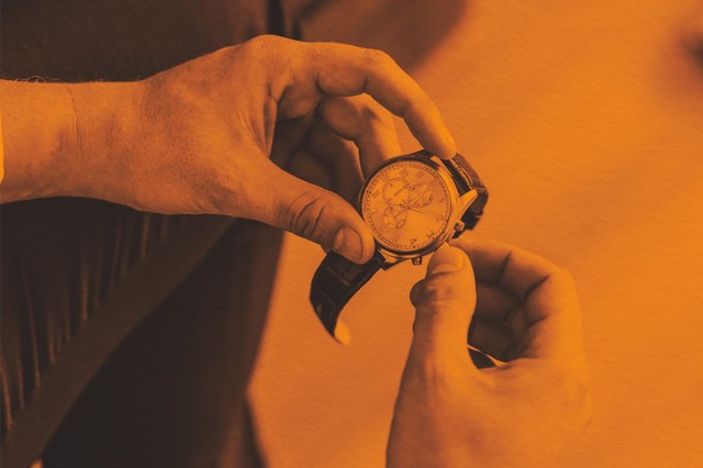 Close-up of checking the time on a watch