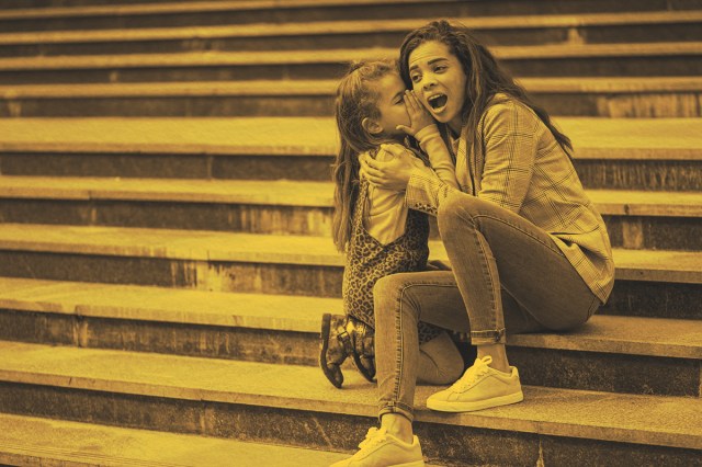 Mom and daughter sharing a secret