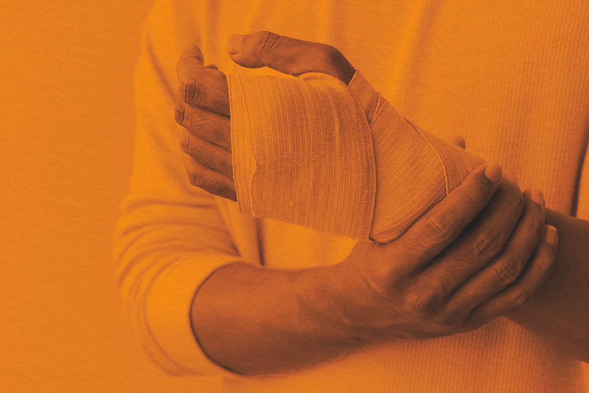 adult man hand with bandage support after get injured by accident
