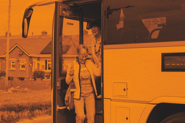 Woman getting off bus