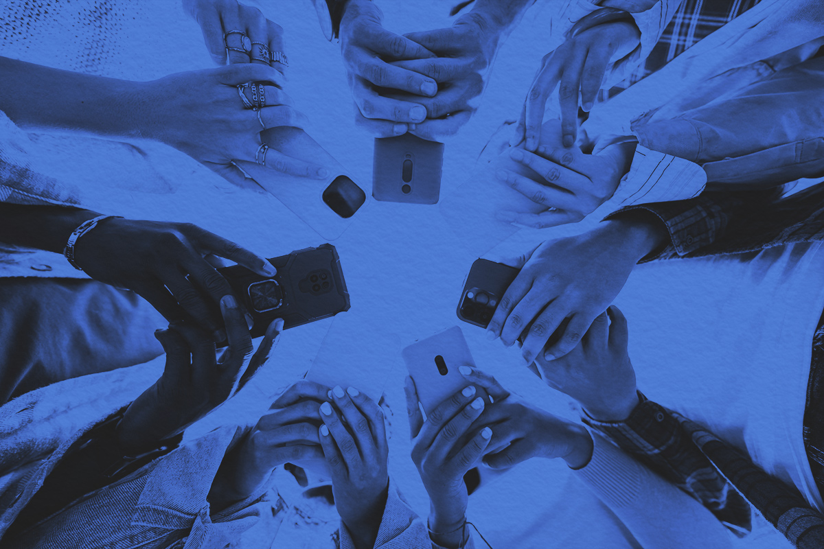 Low angle view of phones covering up the faces of gen z students