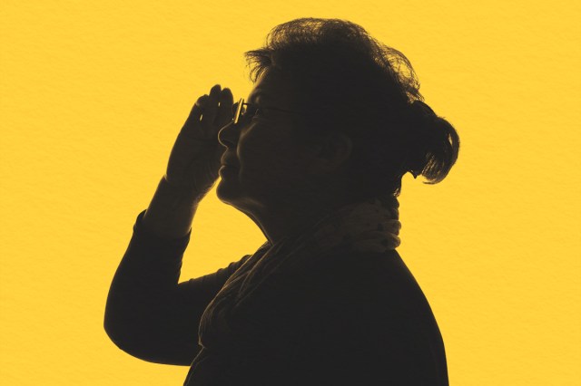 Dark silhouette of an elderly woman